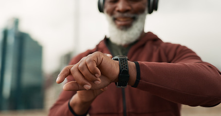 Image showing Man, hands and smart watch in city for fitness, cardio exercise results and workout performance. Closeup, sports gear and runner check timer, stopwatch clock and progress for healthy training outdoor