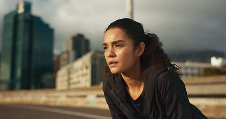 Image showing Woman, athlete and breathe outdoor for fitness, exercise or wellness with city background or nature. Runner, person and tired or relax for workout, training and healthy body with sportswear in street