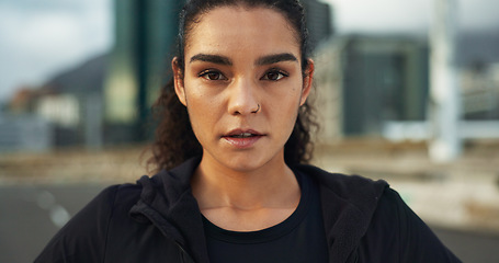 Image showing Fitness, city portrait and woman exercise, determined and ready for outdoor cardio, workout commitment or sports. Sweaty face, road and active athlete, runner or person for street training challenge