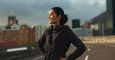 Image showing Training, city smile and outdoor woman looking at view, buildings and happy for morning cardio, wellness or workout. Happiness, fitness and urban athlete, runner or person exercise in Chicago, USA