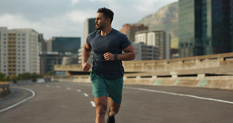 Image showing Runner, road or man for fitness in training, sport or exercise goals for marathon competition. Indian athlete, wellness or running challenge in cape town race in progress, city street or health body