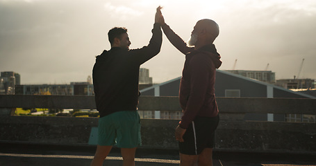 Image showing Man, high five and fitness in city for workout, training or success in outdoor exercise together. Male person, athlete or team touching hands for winning, teamwork or sports achievement in urban town