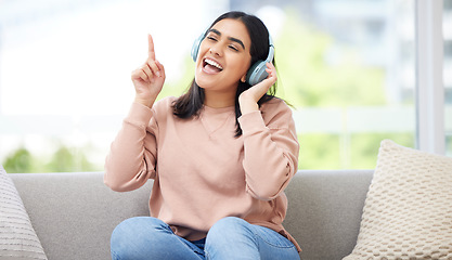 Image showing Singing and listening to music or audio with headphones musician and vocal student streaming songs at home. Young, creative and happy woman can sing song after practicing from melody and sound