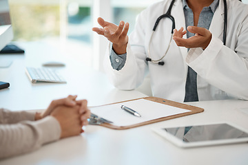 Image showing Hands of medical doctor consulting with patient, giving healthcare advice and discussing sickness sitting at a table at a hospital. Expert, professional and helping gp explaining healthcare problem