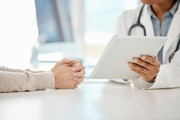 Image showing Doctor giving advice, showing results and consulting woman patient in a clinic or medical facility. Healthcare professional sharing an opinion, diagnosis or results on a tablet to a lady in an office