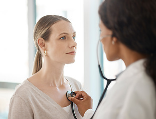 Image showing Doctor listening to stethoscope heartbeat, patient breathing and lungs for healthcare checkup, test and consulting in hospital. Woman with medical screening from cardiology physician for tuberculosis