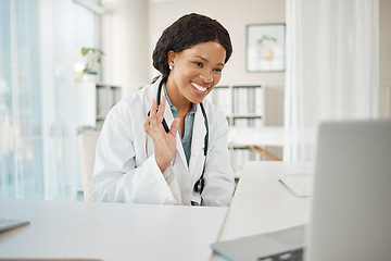 Image showing Video call, virtual medical meeting with a doctor waving, greeting and smiling with a laptop online working at a hospital. Professional healthcare worker doing telemedicine and giving advice
