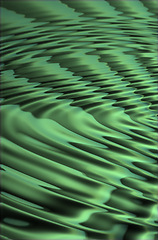 Image showing Closeup of CGI green ripple effect background for computer or digital use. Glowing liquid surface with a abstract, modern pattern or texture. Digital 3D illustration or graphic of colorful water.