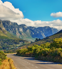 Image showing Copy space with a mountain pass along the Twelve Apostles in Cape Town, South Africa against a cloudy sky background over a peninsula. Calm and scenic landscape to travel or explore on a road trip