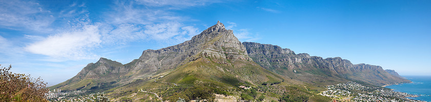 Image showing Landscape of a mountain against a blue sky with copyspace. A popular travel destination for tourists and hikers to explore. View of Table Mountain and the twelve apostles in Cape Town, Western Cape