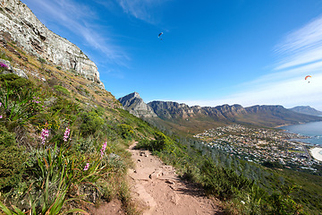 Image showing Scenic hiking trail on a mountain. The twelve apostles in Cape Town, South Africa with plants against a blue sky. Relaxing view of a beautiful and rugged natural landscape to explore and travel