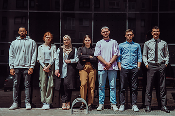 Image showing A diverse and confident group of young businessmen poses together, radiating success, ambition, and unity, capturing the essence of a dynamic and inspiring business environment