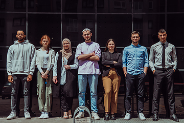 Image showing A diverse and confident group of young businessmen poses together, radiating success, ambition, and unity, capturing the essence of a dynamic and inspiring business environment