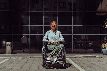 Image showing In front of a modern corporate building, a young woman sitting in a wheelchair confidently, symbolizing empowerment, inclusivity, and the strength to overcome challenges in the business world