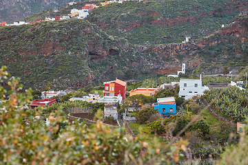 Image showing A small vibrant town or village surrounded by lush green plants or nature on an overcast afternoon in the mountains. View of the beautiful city of Los Llanos, La Palma, and the Canary Islands