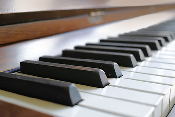 Image showing Closeup of a vintage piano and keyboard for music. Zoom in on an antique and classic musical instrument for a talented musician to play or compose songs and a melody during a performance concert