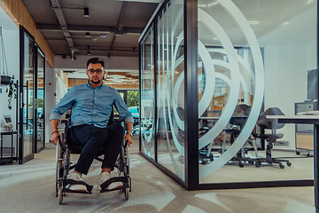 Image showing In a large modern corporation, a determined businessman in a wheelchair navigates through a hallway, embodying empowerment and inclusivity in the corporate world.