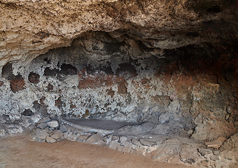 Image showing Abandoned old cave and secret underground tunnel formed from molten lava and igneous rock after a volcanic eruption in Los Llanos, La Palma, Spain. Ancient ruins with hidden stone chamber and cavern