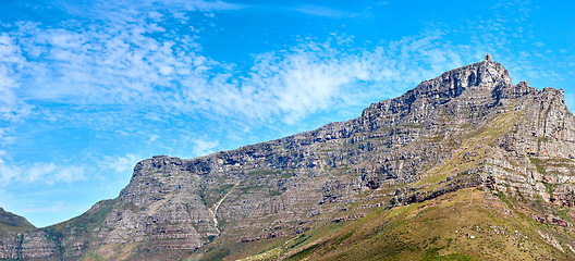 Image showing Landscape of Table mountain, Cape Town, South Africa with copyspace. Panoramic view of rocky terrain with bright blue sky in the background during summer. Scenic view of Africas tourist destination