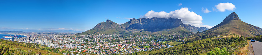 Image showing Wide angle of Cape Town and mountain landscape on a sunny day. Panoramic view of a city against a blue horizon. A popular travel destination for tourists and hikers, in Lions Head, South Africa