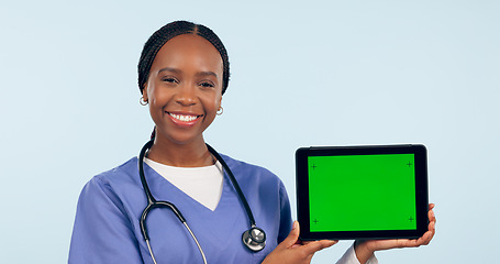 Image showing Green screen, doctor and portrait of black woman with tablet for telehealth, wellness and medical news. Healthcare, mockup and person on digital tech for clinic website in studio blue background