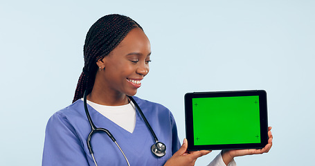 Image showing Green screen, doctor and woman with tablet for telehealth, clinic promotion and medical news. Healthcare, mockup and person on digital technology for website, research and online consulting in studio