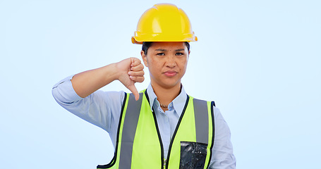 Image showing Woman, thumbs down and engineer for construction by architect in studio by blue background. Asian female, development and negative review for real estate fail, inspection and dislike in mockup