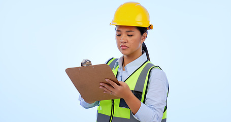 Image showing Woman engineer, inspector and checklist for construction, project management and studio by blue background. Asian female, architecture and development or real estate, plan and safety gear in mockup