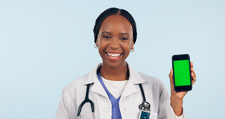 Image showing Green screen, doctor and portrait of black woman with phone for telehealth, wellness app and medical news. Healthcare, mockup and face of person on smartphone for clinic website or contact in studio
