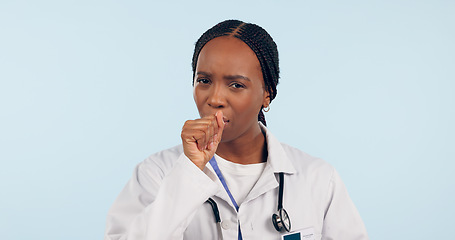 Image showing Sick, cough and portrait of a black woman or doctor for healthcare, virus or medical problem. Nurse, hospital and an African medical employee with covid, asthma or flu on a blue background in studio