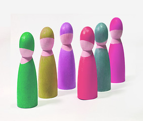 Image showing A series of symbolic images of wood people. Groups of multicolored wooden people. A variety of colors represents different kinds of people. Studio shot of wooden object with a white copy background.