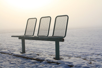 Image showing bench in a snow field