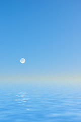 Image showing Seascape and landscape of a blue sky on the westcoast of Jutland in Loekken, Denmark. Beautiful view on an empty beach at dusk. Moon rising over the ocean and sea in the evening with copyspace