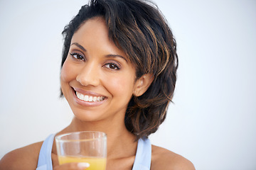 Image showing Fitness, studio and portrait of woman with juice, smile and healthy breakfast diet for weight loss. Nutrition, detox and wellness, happy face of girl with vitamin c drink in glass on white background