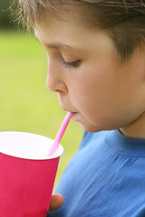 Image showing Drinking a milkshake