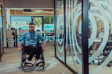 Image showing In a large modern corporation, a determined businessman in a wheelchair navigates through a hallway, embodying empowerment and inclusivity in the corporate world.