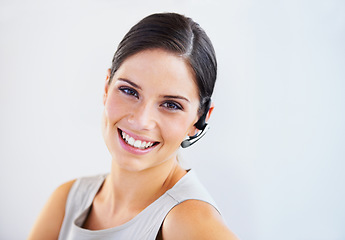 Image showing Happy woman, call center portrait and customer service, e commerce or telemarketing on a white background. Face of business consultant or advisor in headphone for virtual chat or contact us in studio