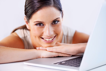 Image showing Happy, laptop and business woman in office with positive, good and confident attitude for career. Smile, pride and professional young female creative designer from Canada with computer in workplace.