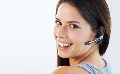 Image showing Woman, call center and communication portrait for customer service, ecommerce or telemarketing on a white background. Face of young consultant or advisor in headphone for chat or contact us in studio