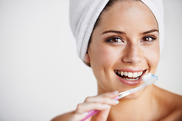 Image showing Woman, smile and brushing for dental hygiene, teeth whitening and healthcare in studio portrait. Happy female person, face and cleaning mouth for protection, care and toothbrush or routine in mockup