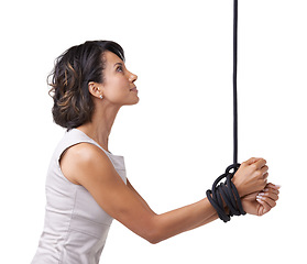 Image showing Woman, business and hands for tied up with rope on white background, studio or mock up in corporate slavery. Person, hostage or prisoner for kidnapping, silence or fear of whistleblower in New York