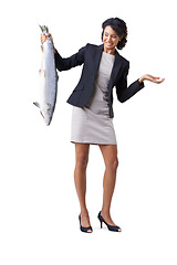 Image showing Shrug, business and a woman with a fish on a white background for marine biology. Doubt, confused and an employee with food from fishing with expression for question, crazy or worry about a mess