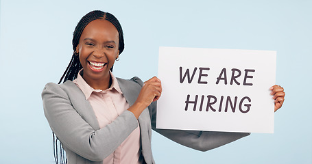 Image showing Business woman, hiring sign and studio portrait with smile for recruitment, welcome or search by blue background. African manager, human resources expert or poster for talent, employee or opportunity
