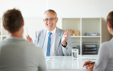 Image showing People, meeting and mature lawyer with advice in office for legal consulting and feedback for clients, Happy, businessman and expert attorney speaking of success as professional advocate in law firm