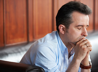 Image showing Man, praying and thinking with stress on sofa in waiting room for interview, recruitment or loss of job. Businessman, anxiety or sitting on couch with fear of unemployment, failure or problem at work