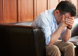 Image showing Sad, man and stress on sofa in waiting room with loss of job from mistake or failure. Businessman, crying and sitting on couch with fear of unemployment, anxiety or frustrated with problem at work