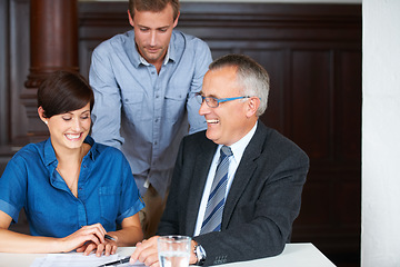 Image showing Business meeting, men and woman with planning, strategy or brainstorming with partnership, collaboration or documents. Employees, people and discussion in office at workplace or company with smile