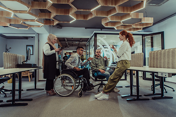 Image showing Young group of business people brainstorming together in a startup space, discussing business projects, investments, and solving challenges.