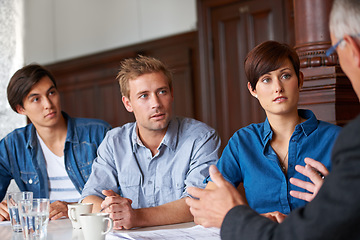 Image showing Business meeting, team and mentor with listening for planning, strategy or brainstorming in office. Employees, men and woman with partnership, collaboration or documents and discussion at workplace