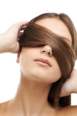 Image showing Woman with hair on eyes isolated in studio with salon hairstyle, confidence and keratin beauty. Strong haircare wellness, natural style and face of model girl with healthy growth on white background.